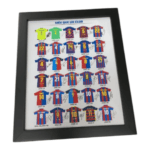 Autographed Barcelona FC football jerseys with legendary player signatures, showcasing club history.