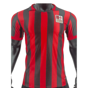 Football jersey with red and black vertical stripes and team crest.