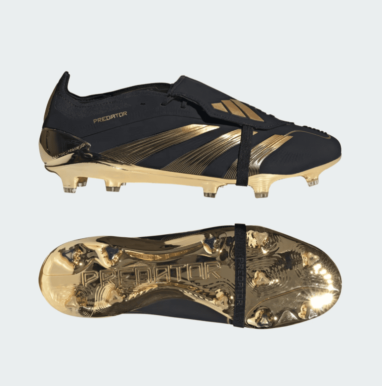 Premium black and gold Adidas Predator football boots for firm ground play.