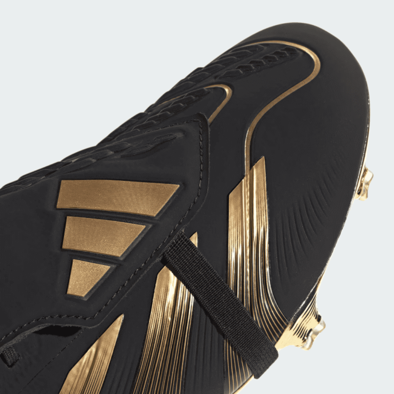 High-performance Adidas Predator Elite FG football boots in black and gold. Perfect for firm ground.