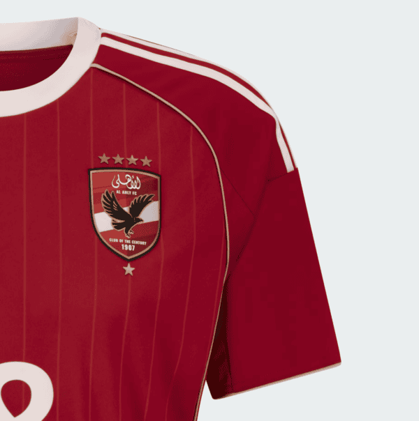 Al Ahly SC 2025/26 home football jersey with team crest and red design.