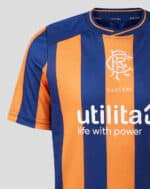 Rangers third football jersey 2023/24 with blue and orange vertical stripes, featuring team logo and.