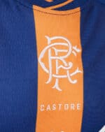Rangers third football jersey 2023/24 with blue and orange design and Castore logo.