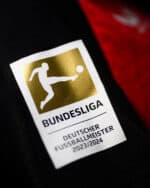 Official Bayer Leverkusen 2024/25 Bundesliga home football jersey with club logo.