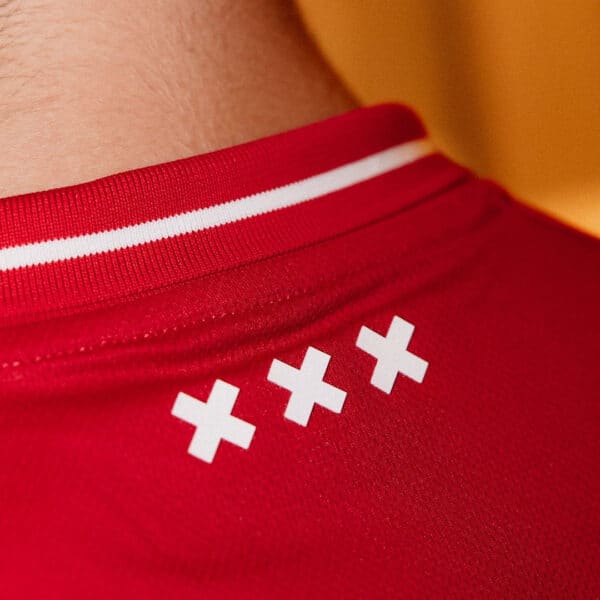 AJX HOME football jersey 2024/25 with red color and white accents.