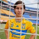 Tigres UANL 2023/24 home football jersey featuring team logo and vibrant yellow design.