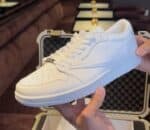 White Travis Scott Air Jordan 1 Low sneakers for men and women.