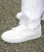 White Air Jordan 1 Low sneakers with Travis Scott collaboration details.