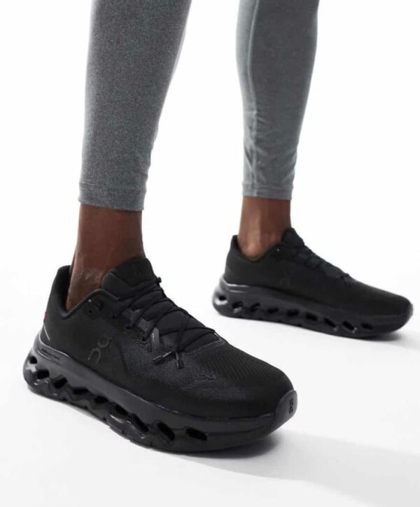 Men's Cloudtilt Triple Black running shoes with breathable mesh and cushioned sole.
