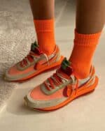 VaporMax Nike sneakers with orange and beige colorway, stylish and comfortable for sports and casual.