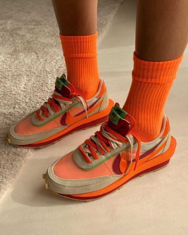 VaporMax Nike sneakers with orange and beige colorway, stylish and comfortable for sports and casual.