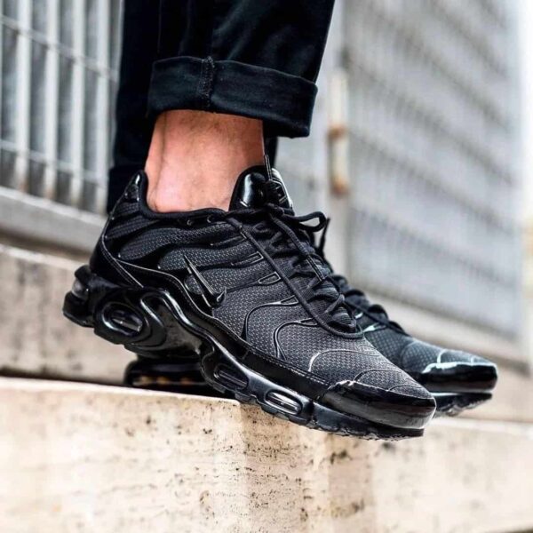 Nike Air Max Plus Triple Black sneakers for men, stylish and comfortable athletic footwear.