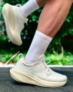 ASICS Gel-Nimbus 26 running shoes in white and off-white, lightweight and cushioned for comfort.