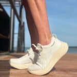 Comfortable ASICS Gel-Nimbus 26 running shoes in white and off-white tones.