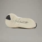 Adidas Y-3 cream Adios 9 running shoe with signature design and lightweight sole. Perfect for traini.