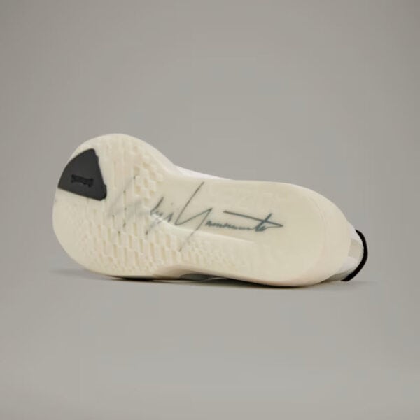 Adidas Y-3 cream Adios 9 running shoe with signature design and lightweight sole. Perfect for traini.