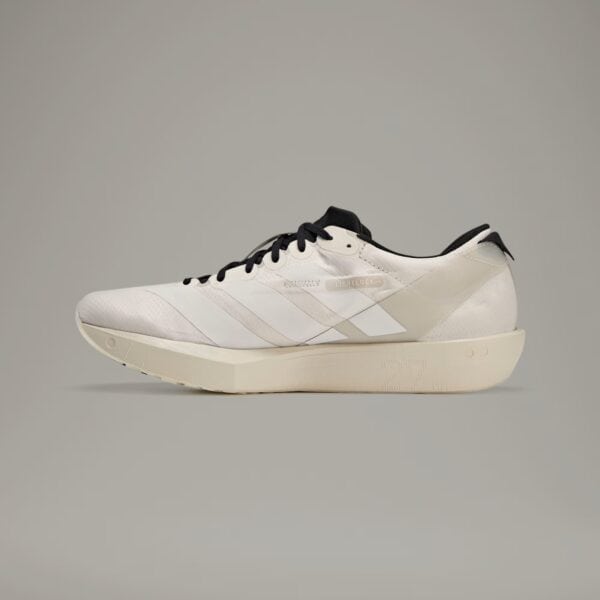 Adidas Y-3 cream training shoes with sleek design and comfortable fit for athletic performance.