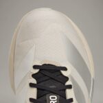 Cream Y-3 Adios 9 running shoes with black laces and lightweight design.