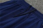 Training suit with Portugal team logo, navy blue color, and athletic design.