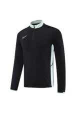 Nike Dri-Fit black athletic tracksuit with white accents, ideal for training and sports activities.