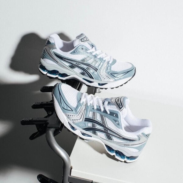 High-performance ASICS Gel-Kayano 14 running shoes in white and grey. Perfect for comfort and suppor.