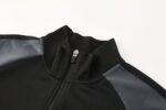Nike Air Dri-fit Jacket in black and white, lightweight sportswear for active athletes.