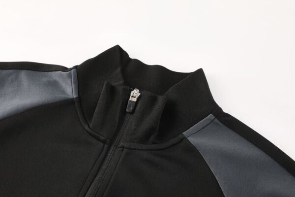 Nike Air Dri-fit Jacket in black and white, lightweight sportswear for active athletes.
