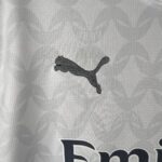 White Puma football jersey with black logo, lightweight sportswear for athletes.