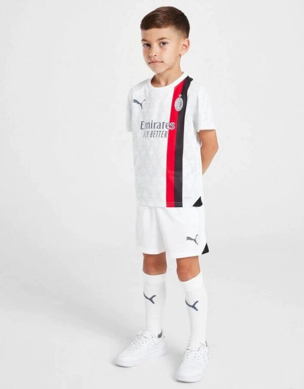 Kids Milan away football kit 2023/24 with team logo and sponsor.