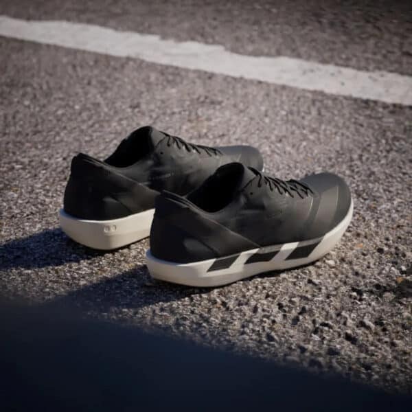 Lightweight Adidas Adizero Adios 9 for fast running and racing. Black and white design with responsi.