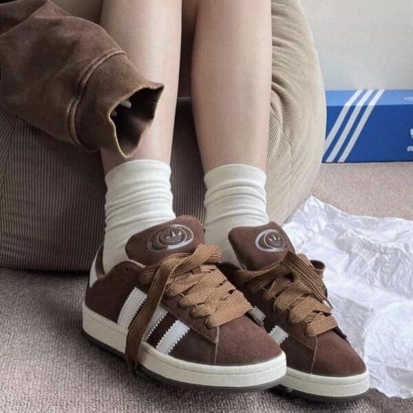 Adidas Campus 00s Bark sneakers with white stripes and brown suede finish.