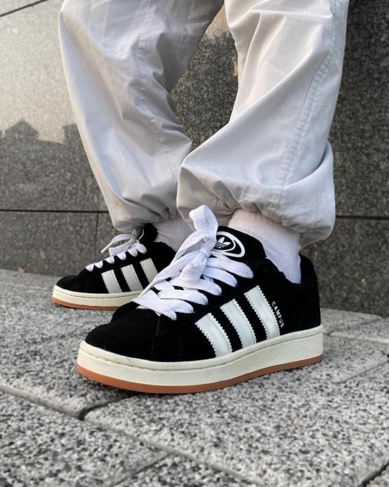 Adidas Campus 00s Core Black sneakers with white stripes and gum sole. Perfect for casual and street.