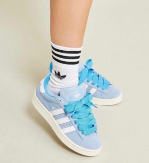 Sky blue adidas Campus 00s sneakers with white stripes and matching laces.