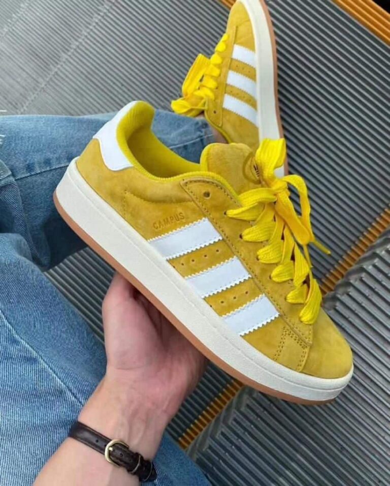 Adidas Campus 00s Spice Yellow sneakers with white stripes and yellow laces. Perfect for casual and.