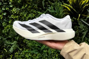Adidas Adizero EVO SL lightweight running shoes with black stripes, ideal for speed and performance.