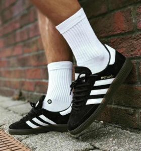 High-quality Adidas Handball Spezial sneakers in black with gum sole. Perfect for casual wear and sp.