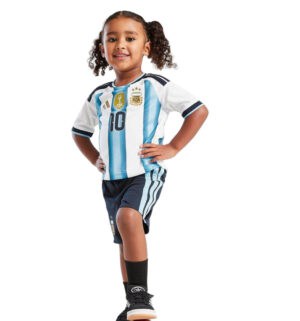 Young girl wearing Argentina national football team home kit, featuring sky blue and white stripes,.