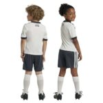 Kids football kit featuring Manchester United third jersey 2024/25.