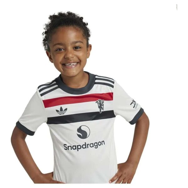 Kids Manchester United third football kit 2024/25, featuring iconic design and team logo. Perfect fo.