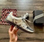 Adidas Samba Wales Bonner in metallic silver with lace-up design.