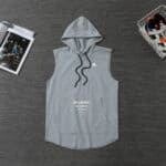 Grey Adidas hoodie vest with front pocket and drawstring hood, perfect for sports and casual wear.