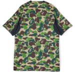Green camouflage football jersey with Bape branding.