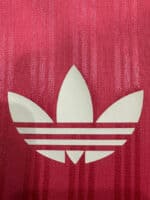 Pink Adidas logo sports shirt for women.