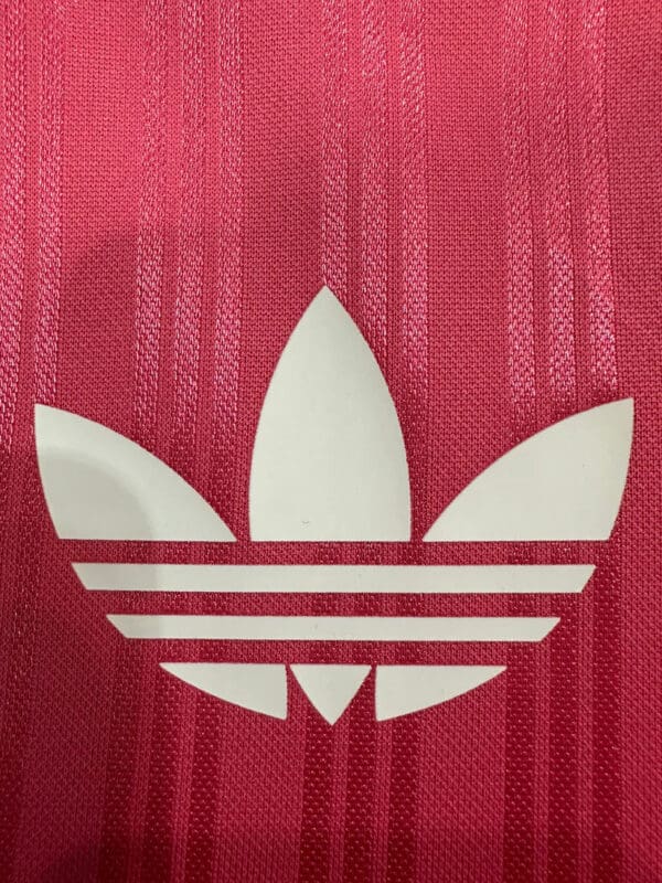 Pink Adidas logo sports shirt for women.