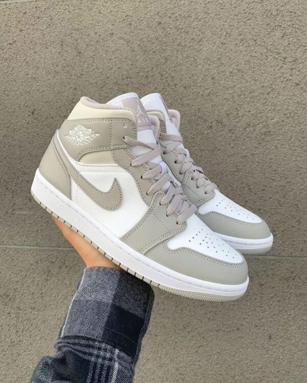 Air Jordan 1 Mid Linen sneakers with neutral tones and classic design.
