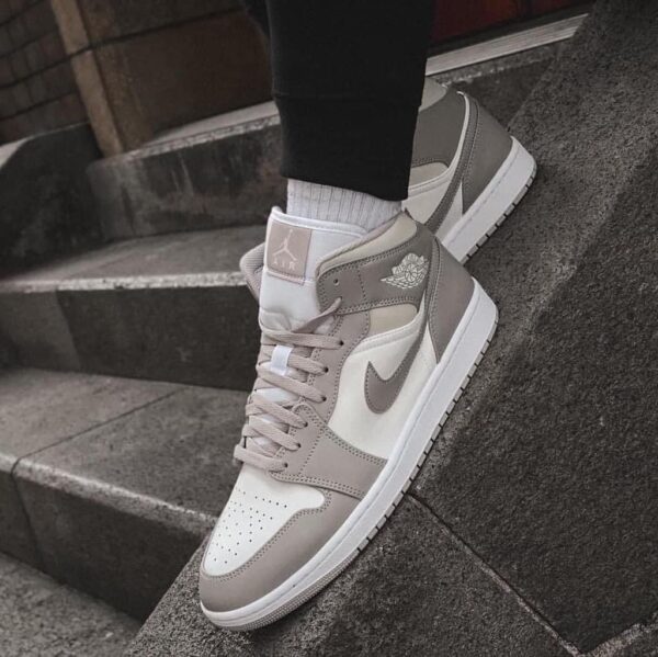 Air Jordan 1 Mid Linen sneaker with neutral tones and stylish design.