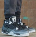 Air Jordan 4 Fear Pack black and grey sneakers with unique design details.