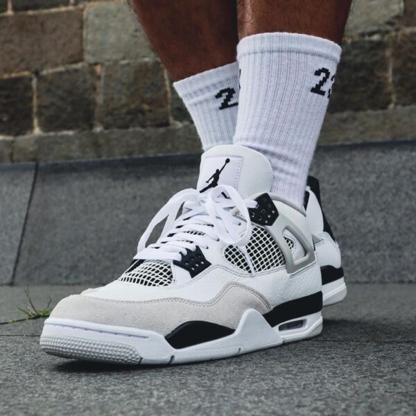 Air Jordan 4 Military Black sneakers for men, stylish athletic footwear with iconic design.