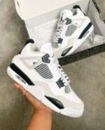 Air Jordan 4 Military Black sneakers with white and black design, iconic basketball shoe.
