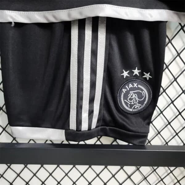 AJAX Kids Third Football Kit 2023/24 with club logo and stylish design.